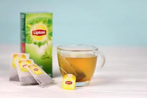 KHARKOV, UKRAINE - DECEMBER 8, 2020 Lipton classic green tea bags. Lipton is a British brand of tea owned by Unilever and PepsiCo photo