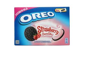 TERNOPIL, UKRAINE - MAY 28, 2022 Oreo golden and strawberry cheesecake crispy cookie box. The brand Oreo is owned by company Mondelez international photo