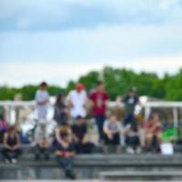 Defocused image of a lot of people with bmx bikes. Meeting of fans of extreme sports photo