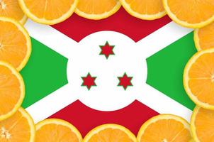 Burundi flag in fresh citrus fruit slices frame photo