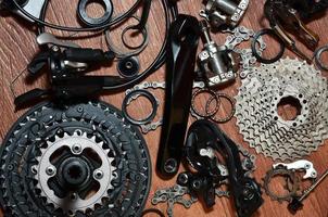 Many different metal parts and components of the running gear of a sports bike photo
