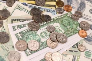 US money bills and coins close up. Big amount of american dollars on table. Business and budget photo