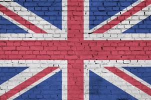 Great britain flag is painted onto an old brick wall photo