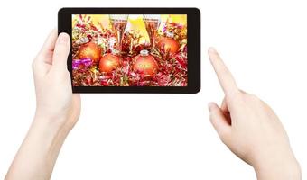 take photo of gold Xmas still life with tablet pc