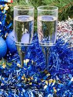 Two glasses with blue Xmas decorations and tree 2 photo