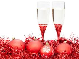 two glasses of wine at red Christmas decorations photo