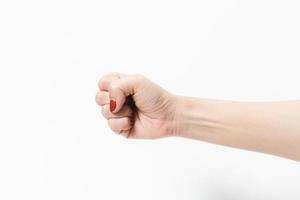 Woman's hands with fist gesture on a white background photo