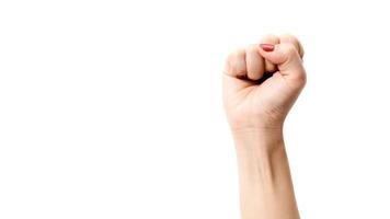 Woman's hands with fist gesture on a white background photo