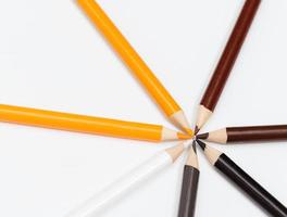Multi color pencils. the concept of a multinational family and equality in the world. photo