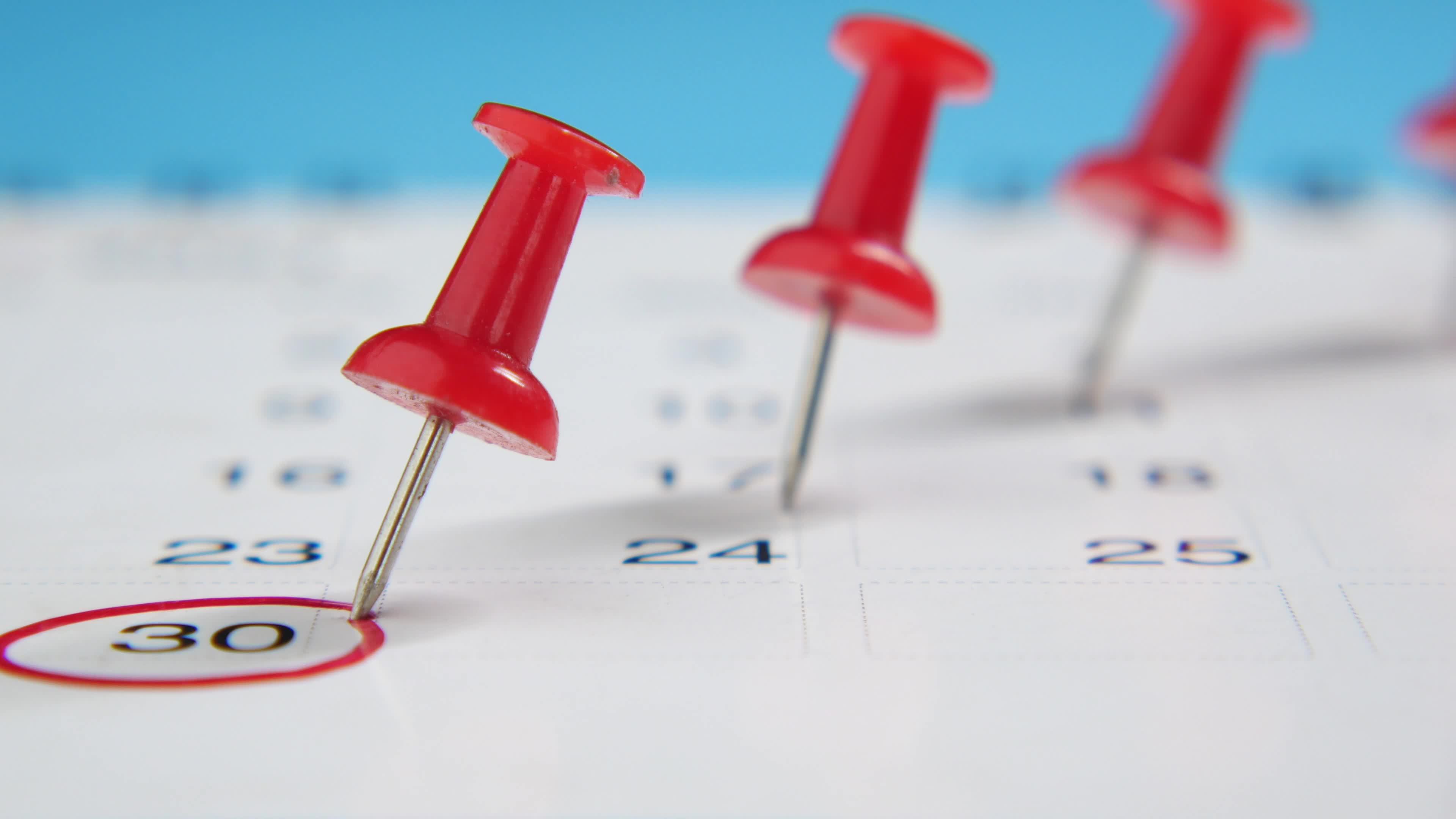 Close up of calendar pins marking dates 13826448 Stock Video at Vecteezy