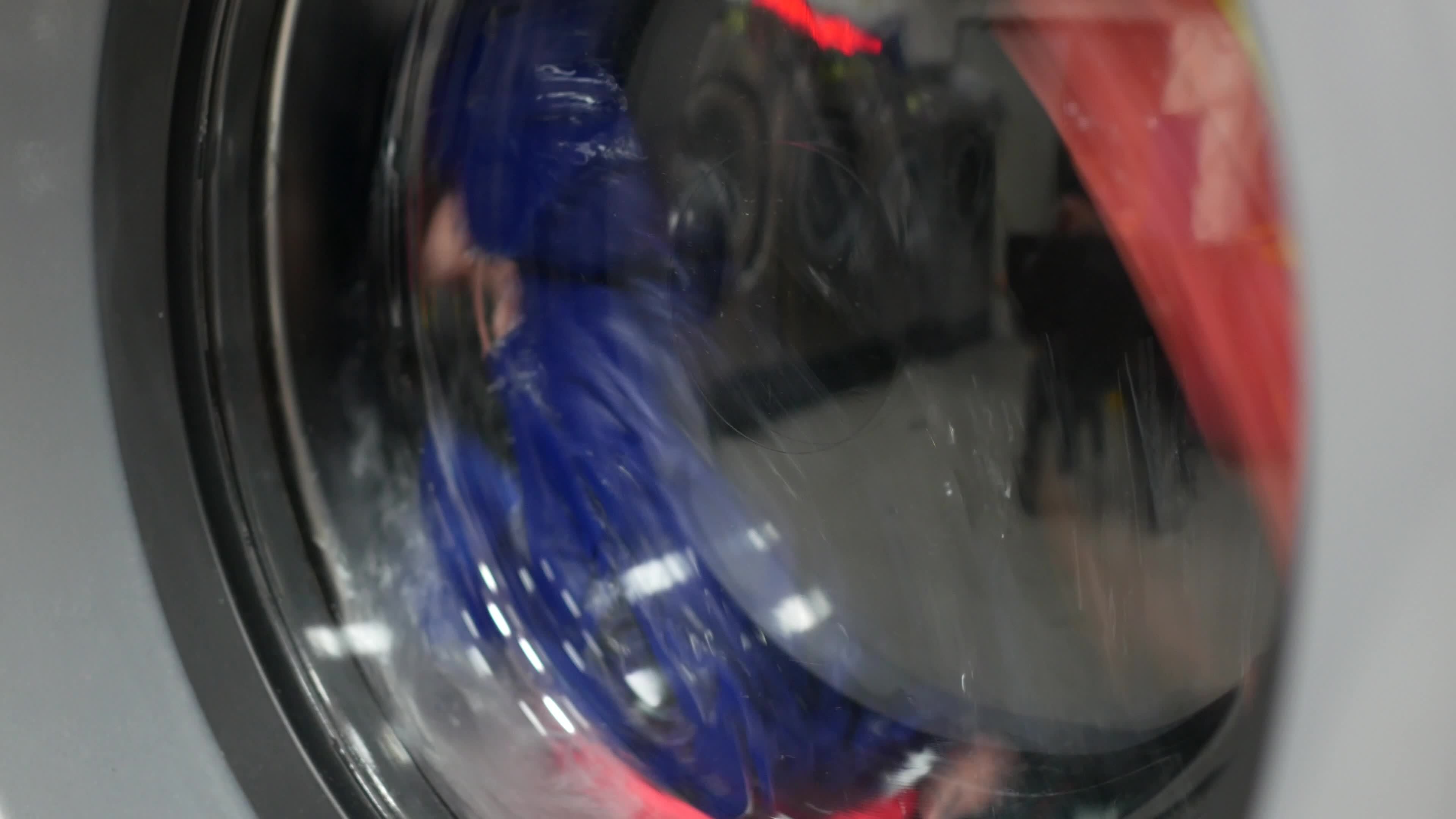 Laundry spins in a washing machine 13826483 Stock Video at Vecteezy