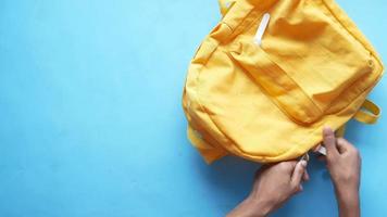 Top view of small yellow back pack video