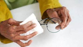 Wiping glass lenses with a tissue video