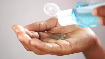 Sanitizing hand with a blue gel video