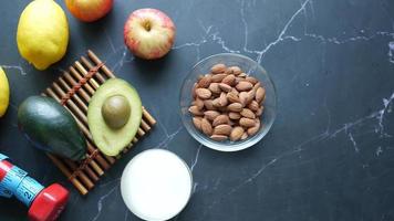 Fruits, almonds and yogurt, measuring tape, avocado video