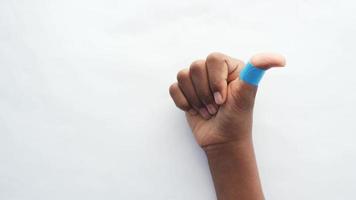 Isolated hand with blue bandaged thumb video