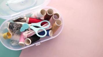 Small sewing kit with scissors thread measuring tape and safety pins