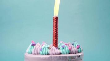 Birthday cake with a huge candle lit video