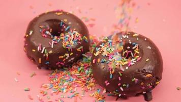 Chocolate covered donuts with sprinkles video