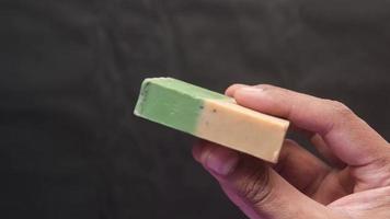 Hand holds a soap bar video