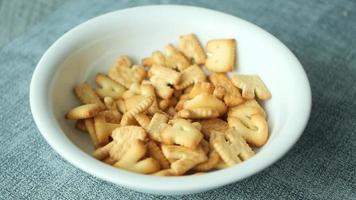 Crackers in letter and number shapes fall into a bowl video