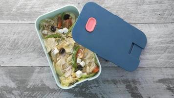 Reusable lunch container with a salad inside video