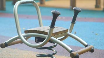 Playground equipment that can function as a seesaw or spring rider video