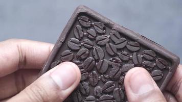 Dark chocolate bar breaking video