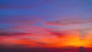 Colorful sunset blue red orange yellow sky with orange cloud video