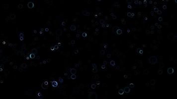 las burbujas abstractas brillan con un tono violeta claro y azul oscuro en el fondo de la pantalla oscura video