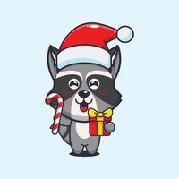 Cute raccoon holding christmas candy and gift. Cute christmas cartoon illustration. vector