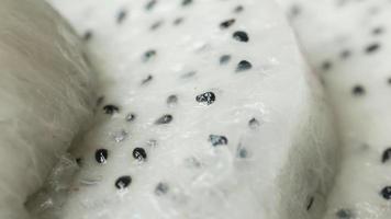 Close up  slice of dragon fruit on a chopping board484 video