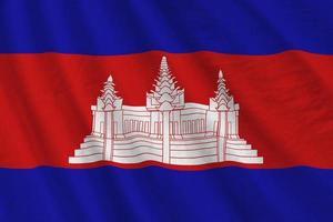 Cambodia flag with big folds waving close up under the studio light indoors. The official symbols and colors in banner photo