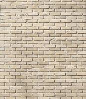 Dark brick wall pattern with chaotic masonry order. Background texture or resource for 3d texturing. Many bricks in big modern stone wall photo