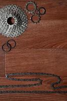 Some composition of a bicycle chain, several sprockets and other components of a sports bike photo