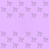 Shopping addiction, shopping lover or shopaholic concept. Many small empty shopping carts perform a pattern on a pastel colored paper background. Flat lay composition, top view photo