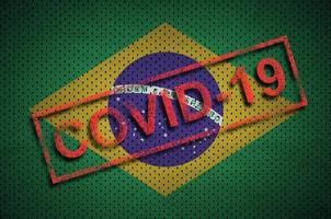 Brazil flag and red Covid-19 stamp. Coronavirus 2019-nCov outbreak photo