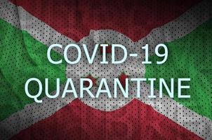Burundi flag and Covid-19 quarantine inscription. Coronavirus or 2019-nCov virus photo
