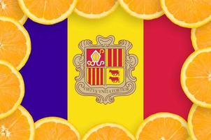 Andorra flag in fresh citrus fruit slices frame photo