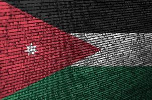 Jordan flag is depicted on the screen with the program code. The concept of modern technology and site development photo