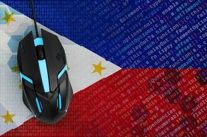 Philippines flag and computer mouse. Digital threat, illegal actions on the Internet photo