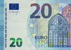 Fragment part of 20 euro banknote close-up with small blue details photo