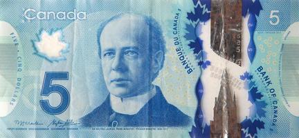 retrato de sir wilfrid laurier de canadá fragmento de billetes de polímero de 5 dólares de 2013 foto