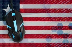 Liberia flag and computer mouse. Digital threat, illegal actions on the Internet photo