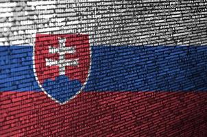 Slovakia flag is depicted on the screen with the program code. The concept of modern technology and site development photo