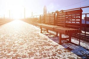 Empty railway station platform photo