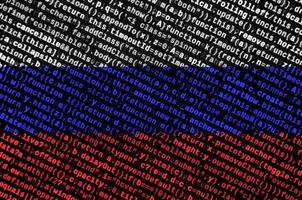 Russia flag is depicted on the screen with the program code. The concept of modern technology and site development photo