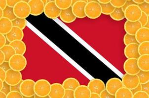 Trinidad and Tobago flag in fresh citrus fruit slices frame photo