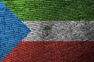 Equatorial Guinea flag is depicted on the screen with the program code. The concept of modern technology and site development photo