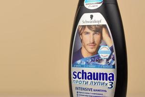 KHARKOV, UKRAINE - MAY 3, 2022 Schwarzkopf schauma shampoo plastic bottle for men. Cosmetics company Hans Schwarzkopf GmbH was acquired by Henkel in 1995 photo